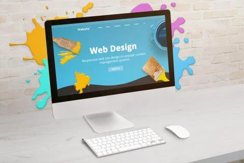 Concept of web design studio with coimputer display and color drops on brick  Stock Photos