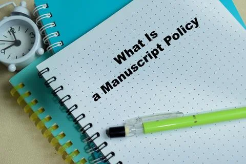 Concept of what is a manuscript policy write on book isolated on Wooden Table 스톡 사진
