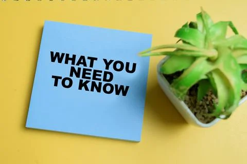 Concept of what you need to know write on sticky notes isolated on table. Stock Photos