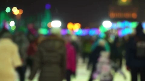 Concept Winter. Crowd at Night Skating Rink. Falling Snow. Christmas Star Blure Stock Footage 70424691