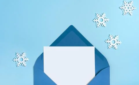 Concept Winter pattern made small white snowflakes letter pastel blue Stock Photos