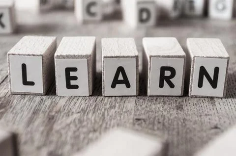 Concept word forming with cube - Learn Stock Photos