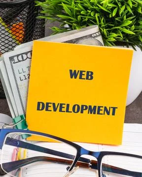 Concept word WEB DEVELOPMENT written on a yellow sticker, front view. Conce.. Foto stock