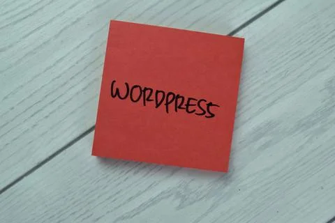 Concept of Wordpress write on sticky notes isolated on Wooden Table. 스톡 사진