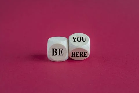 Concept words Be here Be you on wooden cubes. Beautiful red background. Stock Photos
