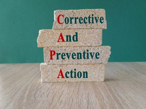 Concept words CAPA, corrective and preventive actions on brick blocks Stock-Fotos