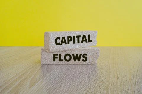 Concept words Capital Flows on beautiful brick blocks. Stock Photos