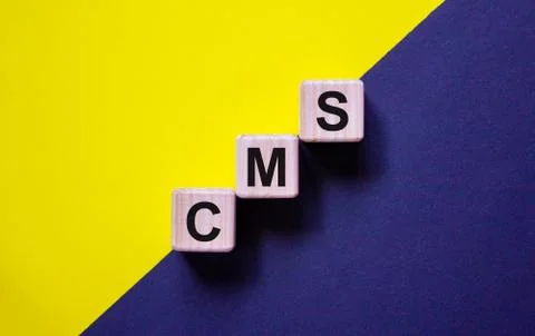 Concept words 'CMS, content management system' on wooden cubes on a beautiful Stock Photos
