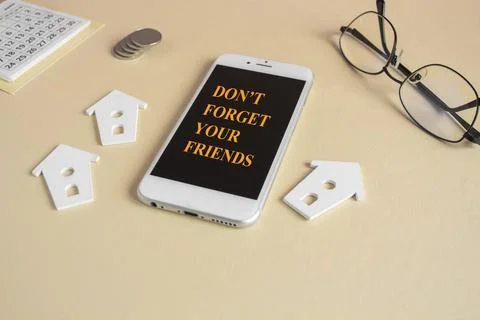 Concept words Don't Forget Your Friends on the mobile phone screen. Stock Photos