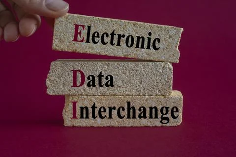 Concept words EDI electronic data interchange on brick blocks. Stock Photos