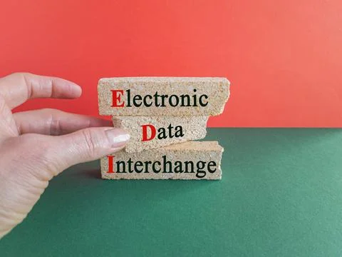 Concept words EDI electronic data interchange on brick blocks. Stock Photos