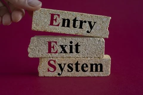 Concept words Entry Exit System on brick blocks. Beautiful red background. 스톡 사진