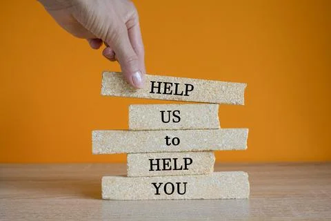 Concept words HELP US TO HELP YOU on brick blocks. Foto stock