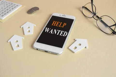 Concept words Help wanted on the mobile phone screen. Foto stock