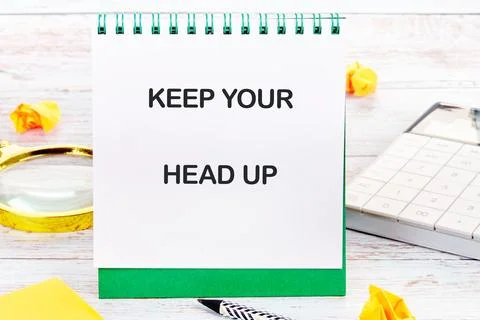 Concept words KEEP YOUR HEAD UP written on a desktop notebook with decorative Stock Photos