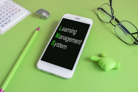 Concept words LMS (Learning Management System) written on the mobile phone Stock Photos