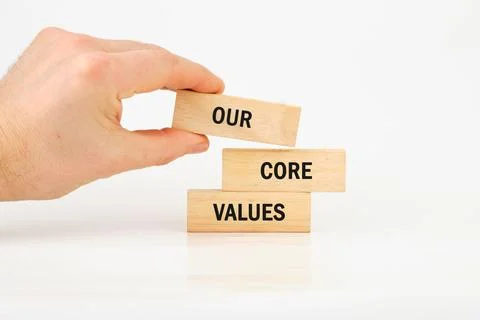 Concept words OUR CORE VALUES symbol on wooden blocks assembled by hand 写真素材
