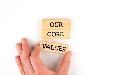 Concept words OUR CORE VALUES symbol on wooden blocks laid out by hand 写真素材