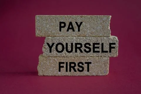 Concept words Pay yourself first on beautiful brick blocks. Foto stock