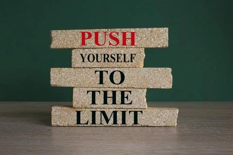 Concept words Push yourself to the limit on brick blocks. Foto stock