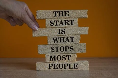 Concept words The start is what stops most people. Words on brick blocks. Foto stock