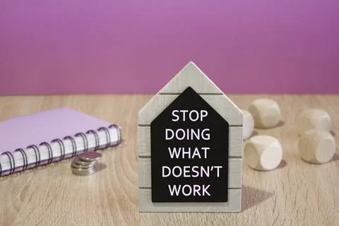 Concept words Stop Doing What Doesn't Work on a black board. Stock Photos