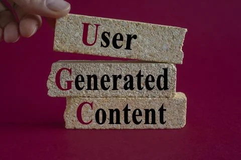 Concept words UGC user generated content on brick blocks. Stock Photos