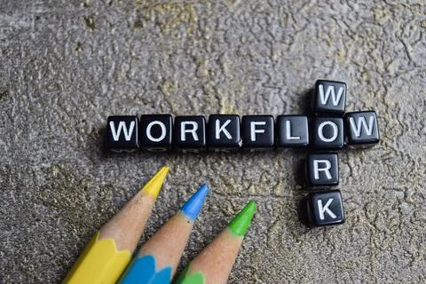 Concept of work and workflow words arranged with on wooden letter blocks. Stock Photos