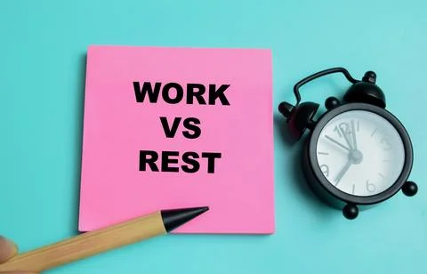Concept of work vs rest write on sticky notes isolated on table. Stock Photos