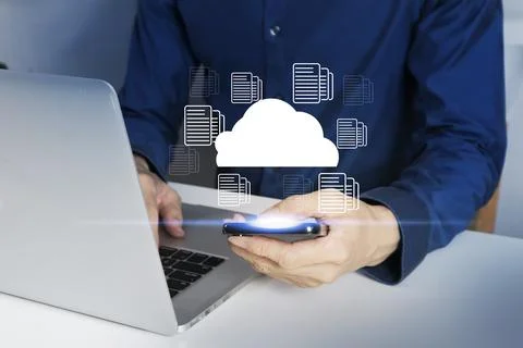 The concept of working with a cloud system that links databases through mob.. Stock Photos