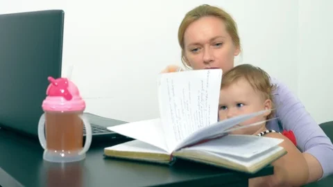 Concept of working mom, freelancing. happy mother working at home with laptop Stock Footage 102894591
