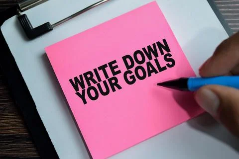 Concept of write down your goals write on sticky notes Stock Photos