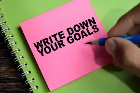 Concept of write down your goals write on sticky notes Stock Photos