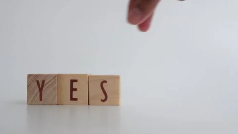The concept of YES or NO decision-making written on wooden blocks. Video stock 335439609