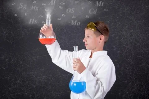 Concept of young boy chemist Stock Photos