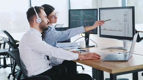 Conception of teamwork. Two employees are in the office together. Stock Footage 297686235