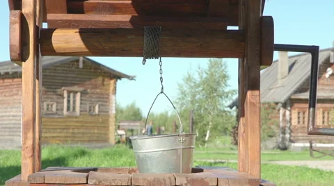 Concepts and ideas Preservation of environment. Well. Empty bucket. SLOW MO Video stock 69012141