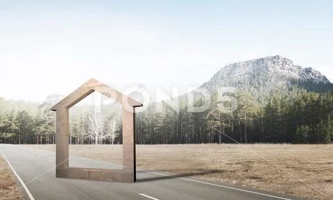 Conceptual background image of concrete home sign on asphalt road Stock Photos