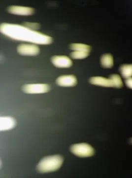 Conceptual black pattern with different elements  with shadows and light Stockfoto's