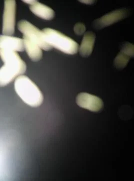 Conceptual black shiny particles texture with different elements. Background  Foto stock