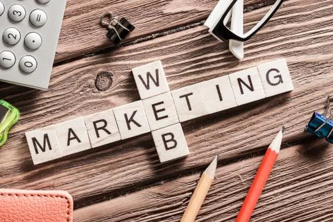 Conceptual business keywords on table with elements of game making crossword Stock Photos