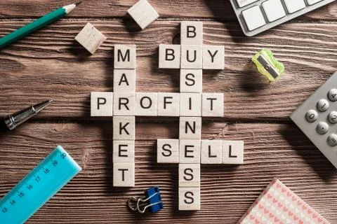 Conceptual business keywords on table with elements of game making crossword Stock Photos