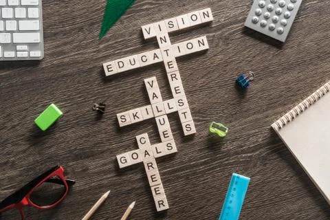 Conceptual business keywords on table with elements of game making crossword Stock Photos