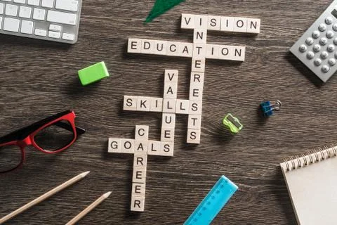 Conceptual business keywords on table with elements of game making crossword Stock Photos