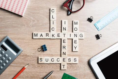 Conceptual business keywords on table with elements of game making crossword Stock Photos