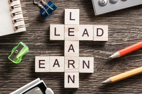 Conceptual business keywords on table with elements of game making crossword Foto stock