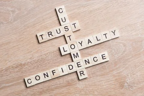 Conceptual business keywords on table with elements of game making crossword Stock Photos