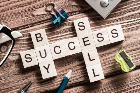 Conceptual business keywords on table with elements of game making crossword Stock Photos
