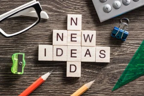 Conceptual business keywords on table with elements of game making crossword Stockfoto's