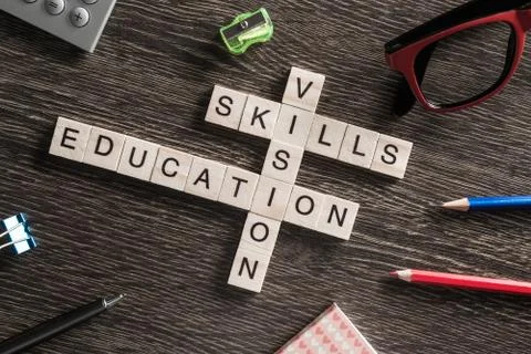 Conceptual business keywords on table with elements of game making crossword Stock Photos